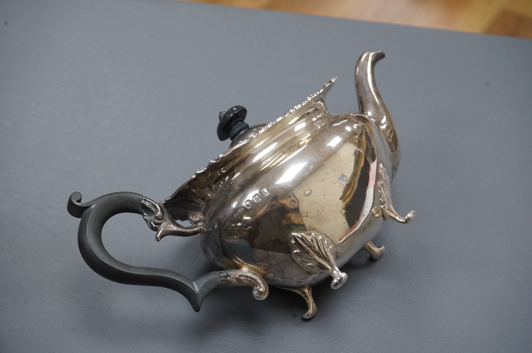 An Edwardian Scottish silver three piece oval tea set by Weir & Sons, Glasgow, 1901, gross 25.5oz, with foliate borders.